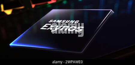 Viersen, Germany - March 1. 2024: Closeup of smartphone screen with logo lettering of Samsung Exynos processor chip on computer keyboard Stock Photo