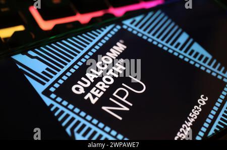 Viersen, Germany - March 1. 2024: Closeup of smartphone screen with logo lettering of Qualcomm Zeroth NPU neural processor on computer keyboard Stock Photo