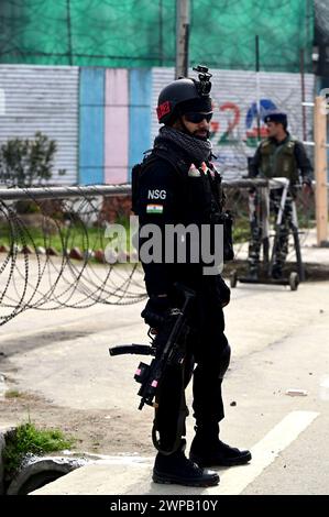 Srinagar, India. 06th Mar, 2024. SRINAGAR, INDIA - MARCH 6: National Security Guard (NSG), Commandos stands guard outside Bakshi Stadium, the main venue of Prime Minister Narendra Modi's public rally on March 6, 2024 in Srinagar, India. (Photo by Waseem Andrabi/Hindustan Times/Sipa USA) Credit: Sipa USA/Alamy Live News Stock Photo