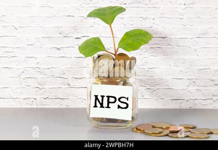 concept word NPS .Net Promoter Score. on wooden cubes text on wooden blocks. on a gray background. Stock Photo