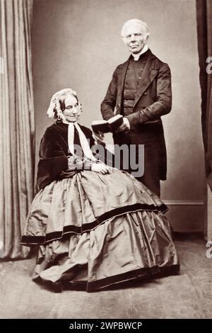 John Keble (1792–1866) English Anglican priest, poet, theologian, and one of the leaders of the Oxford Movement, in a studio portrait with his wife, Charlotte. Keble College at Oxford University is named in his honor. Stock Photo