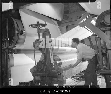 . Man working with pulp and paper machinery at Thorold, Ontario, Canada 1945.  Vintage Historical Photograph Stock Photo
