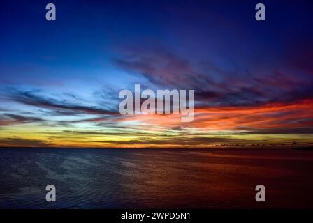 Dramatic Caribbean Sky with yellow, blue, orange and red Stock Photo