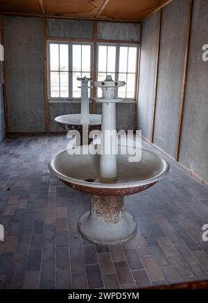 Munich Germany Interior of living quarters, showing wash stands, at Dachau Concentration Camp, Munich, Germany. Stock Photo