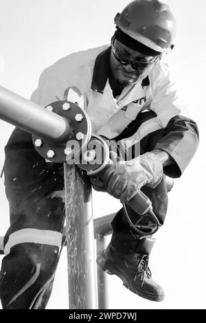 A monochrome shot of a construction worker working in Johannesburg, South Africa Stock Photo