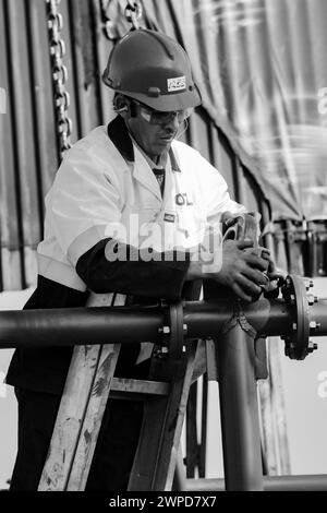 A monochrome shot of a construction worker working in Johannesburg, South Africa Stock Photo