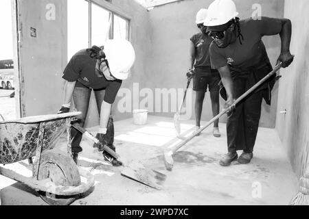 A monochrome shot of construction workers working in Johannesburg, South Africa Stock Photo