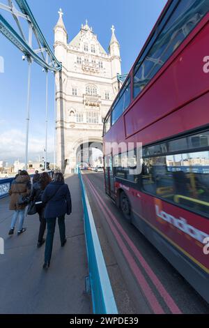 UK, London, London Bus going over Tower Bridge. Stock Photo