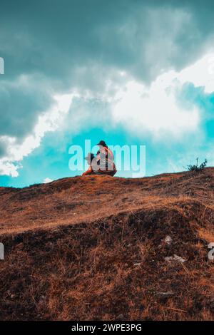 Two people from Peru on top of a hill. Stock Photo