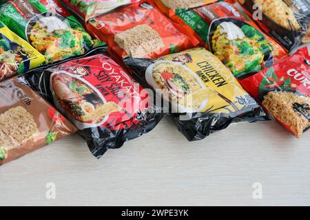 KYIV, UKRAINE - OCTOBER 31, 2023 Many packs of instant noodles for fast cooking by various brands and manufacturers close up Stock Photo