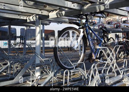 Cycle parking facilities at Farnborough Main railway station with bike racks, Farnborough, Hampshire, UK Stock Photo