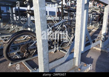 Cycle parking facilities at Farnborough Main railway station with bike racks, Farnborough, Hampshire, UK Stock Photo