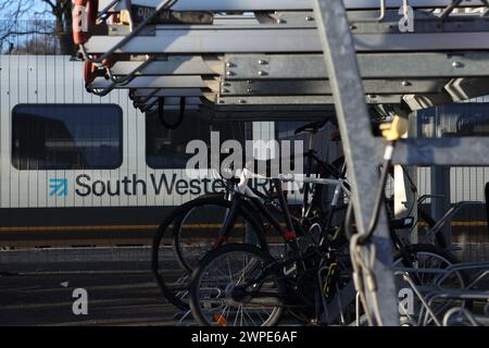 Cycle parking facilities at Farnborough Main railway station with bike racks, Farnborough, Hampshire, UK Stock Photo