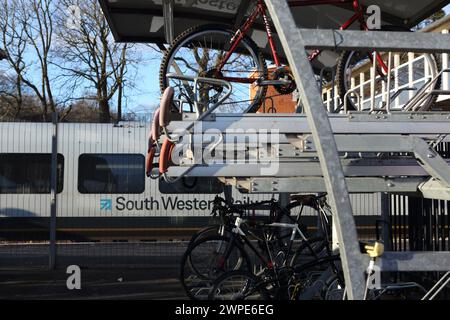 Cycle parking facilities at Farnborough Main railway station with bike racks, Farnborough, Hampshire, UK Stock Photo