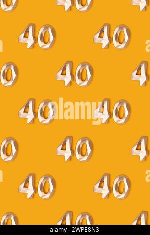Pattern made of golden number 40 on a yellow background. Stock Photo
