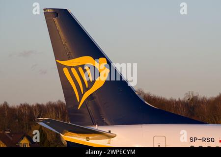 Irish low-cost airline's Ryanair Boeing 737-800 vertical stabilizer close-up while taxiing at Lviv Airport during golden hour Stock Photo