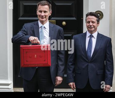 London, UK. 06th Mar, 2024. Jeremy Hunt, MP, Chancellor of the Exchequer, and Financial Secretary to the Treasury, Nigel Huddleston, outside No 11 Downing Street with the iconic red despatch box, before he delivers the Spring Budget to Parliament. Credit: Imageplotter/Alamy Live News Stock Photo