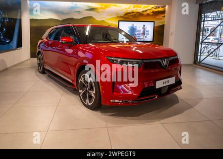 new red Vinfast vf 9 electric SUV in Studio, advanced technologies in vietnamese automotive industry, Environmental sustainability, Car dealerships, t Stock Photo