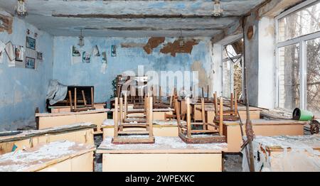 March 1, 2024, Chervona Dolyna, Mykolaiv Reg, Ukraine: A partially damaged school classroom is seen in a school destroyed by rocket and artillery fire in the village of Chervona Dolyna. Destroyed school in Chervona Dolyna village, Mykolaiv region of Ukraine, as a result of rocket and artillery shelling of civilian infrastructure by Russian occupation troops. Every seventh school in Ukraine has been damaged by military attacks. More than 200 schools in Ukraine have been destroyed and 1,600 damaged as a result of enemy attacks. At present, some 900,000 children in Ukraine study at a distance bec Stock Photo