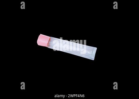 transparent Glass bottle. Isolated Black background. Top View Stock Photo