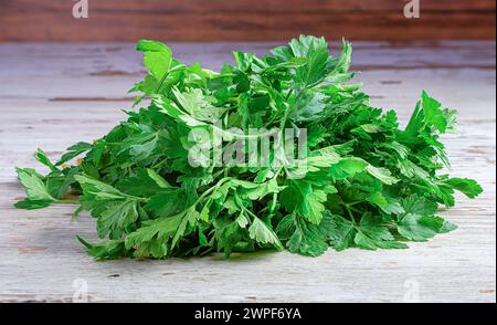 A Pile of Parsley on a Wooden Surface Stock Photo