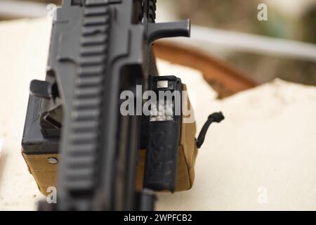 Close up view of a machine gun. Selective focus with shallow depth of field. Stock Photo