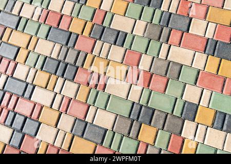 Colorful pavement on sunny day in public park. Colorful paving stones in urban park landscaping design as background Stock Photo