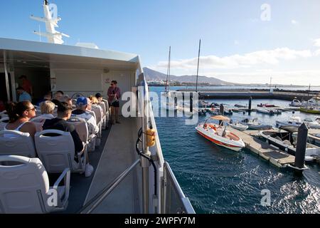 on board the lineas romero fast passenger ferry between playa blanca Lanzarote and corralejo fuerteventura leaving playa blanca harbour, Canary Island Stock Photo