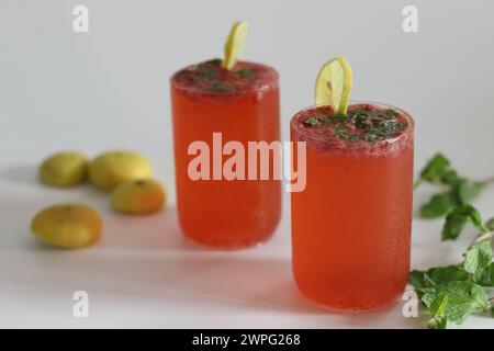 Refreshing strawberry mojito with vibrant colors, mint leaves, lime and ice, perfect for summer vibes, parties and picnics, Tropical cocktails, and fr Stock Photo
