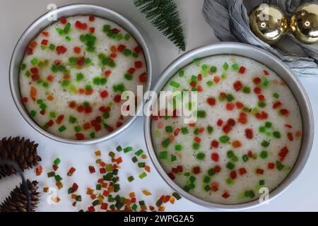 Vattayappam with tutti fruity, a Kerala sweet dish. Vattayappam is a steamed rice cake with coconut and yeast. Tutti fruity are candied fruits. Shot o Stock Photo