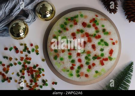 Vattayappam with tutti fruity, a Kerala sweet dish. Vattayappam is a steamed rice cake with coconut and yeast. Tutti fruity are candied fruits. Shot o Stock Photo