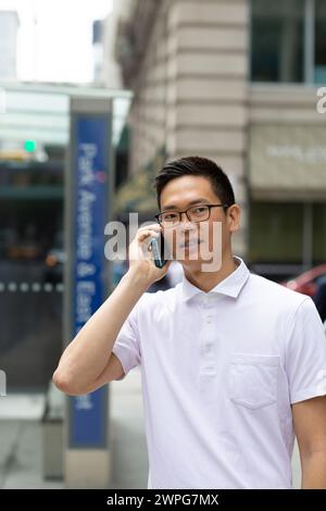Chinese businessman talking on cell phone Stock Photo