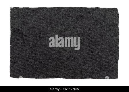 A piece of torn black fabric on a white background. Dark isolate material for sewing clothes Stock Photo