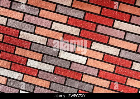 Wall made of multi-colored bricks. Bricks background. Abstract texture Stock Photo