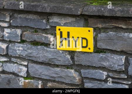Sign on wall indicating the location of the nearest fire hydrant, Ireland. Stock Photo