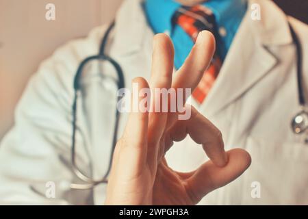 A male doctor making an upturned hand gesture. Studio isolated background, copyspace. Health, medical business banner Stock Photo