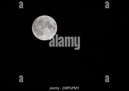 Full moon against a black sky Stock Photo