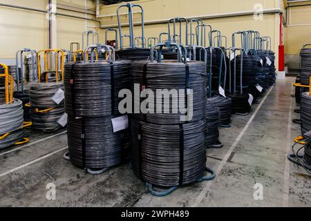 Steel wire coils in metalworking factory. Stock Photo