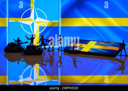 Brussels, Belgium. 07th Mar, 2024. NATO - Sweden flag visible in the background with miniature figures of solders in this photo illustration. Taken in Brussels, Belgium. On March 7, 2024. (Photo by Jonathan Raa/Sipa USA) Credit: Sipa USA/Alamy Live News Stock Photo