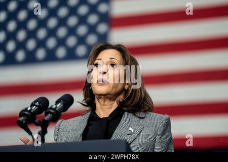 United States Vice President Kamala Harris gives a speech with the American Flag filling the frame in the background Stock Photo