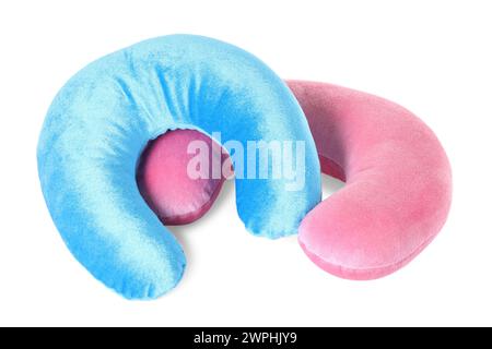 Pink and blue travel pillows isolated on white Stock Photo