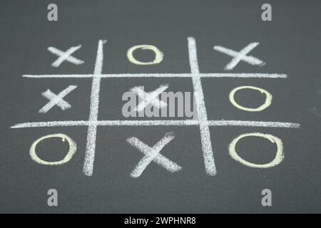 Tic tac toe game drawn on chalkboard Stock Photo