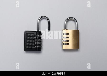Steel combination padlocks on grey background, top view Stock Photo
