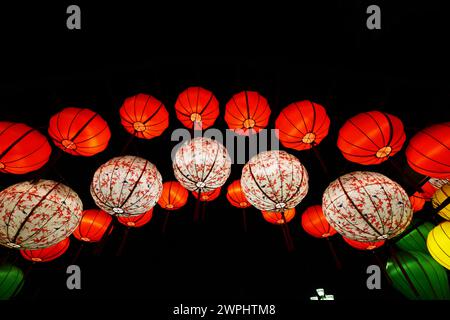 Traditional silk lanterns hanged over a street in the old city of Hội An, Vietnam. Stock Photo