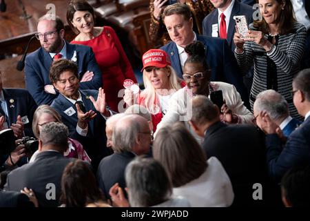 Washington, United States. 07th Mar, 2024. Rep. Marjorie Taylor Greene, R-GA, wears a 'Make America Great Again' hat and holds a pin for Laken Riley, a University of Georgia nursing student killed by an illegal immigrant while on a run, as President Joe Biden arrives at the annual State of the Union speech to a joint session of Congress at the U.S. Capitol in Washington DC on Thursday, March 7, 2024. Photo by Bonnie Cash/UPI Credit: UPI/Alamy Live News Stock Photo