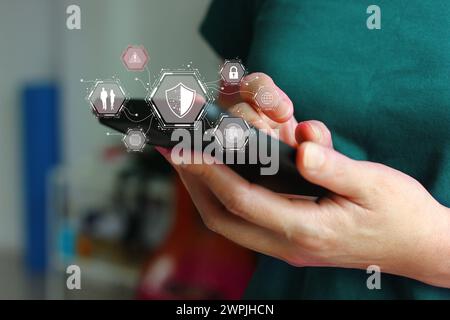 Asian woman using mobile phone online with safety protect by security app Stock Photo