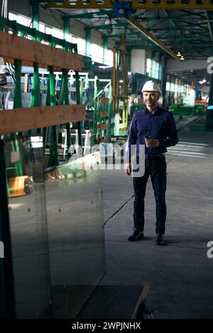 Employee at a coffee break in a production workshop Stock Photo