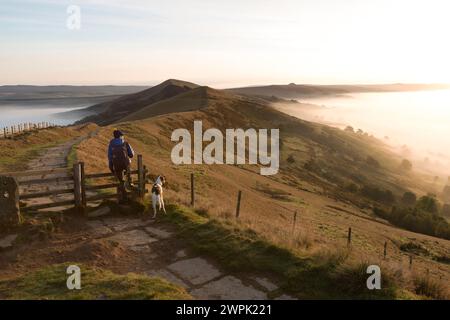 UK, Mam Tor ridge, walker in the early morning along the ridge - Peak District. Stock Photo