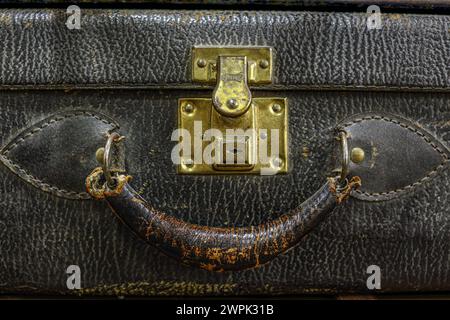 Close up of an vintage suitcase with leather handle Stock Photo