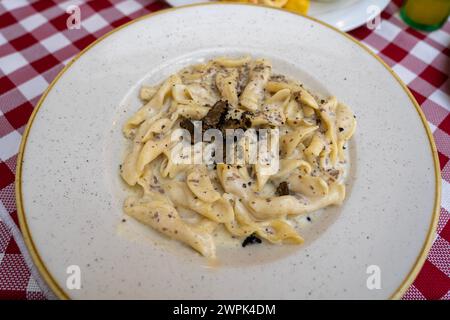 fuzi istrian pasta with black truffle tartufo mashroom and cream traditional food in Rovinj Croatia . Stock Photo